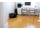 Home office area featuring bamboo floors, white desk, and printing equipment at 601 Gay Rd, Seffner, FL 33584