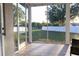 Inviting screened porch with tiled floor, perfect for enjoying the backyard views and outdoor living in comfort at 601 Gay Rd, Seffner, FL 33584