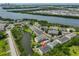 Aerial view of property surrounded by lush landscape, lake, and views of Tampa at 618 Wheaton Trent Pl, Tampa, FL 33619