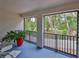 Screened balcony providing a peaceful outdoor space with a view of lush greenery at 618 Wheaton Trent Pl, Tampa, FL 33619