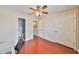 Bedroom featuring hardwood floors and access to bathroom at 618 Wheaton Trent Pl, Tampa, FL 33619