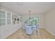 Elegant dining room with a glass table and built-in cabinets at 618 Wheaton Trent Pl, Tampa, FL 33619