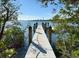 Picturesque dock view, showcasing sturdy construction with stunning city skyline in the distance under a clear blue sky at 618 Wheaton Trent Pl, Tampa, FL 33619