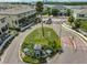 Community entrance surrounded by manicured landscaping at 618 Wheaton Trent Pl, Tampa, FL 33619