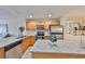 Well-lit kitchen featuring wooden cabinets and stainless steel appliances at 618 Wheaton Trent Pl, Tampa, FL 33619