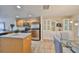 Bright kitchen featuring stainless steel appliances, granite counters, and an island at 618 Wheaton Trent Pl, Tampa, FL 33619