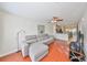 Spacious living room features sleek hardwood flooring and is open to the kitchen at 618 Wheaton Trent Pl, Tampa, FL 33619