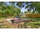 Spacious backyard patio with comfortable seating, offering a tranquil and inviting outdoor living space at 6213 S Queensway Dr, Temple Terrace, FL 33617