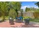 Inviting backyard patio features stylish outdoor seating and a serene ambiance, perfect for relaxing and entertaining at 6213 S Queensway Dr, Temple Terrace, FL 33617