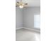 A neutral-toned bedroom with lots of natural light and a ceiling fan at 6213 S Queensway Dr, Temple Terrace, FL 33617