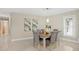 Bright dining room featuring modern decor, stylish furnishings and neutral color palette, perfect for comfortable Gathering meals at 6213 S Queensway Dr, Temple Terrace, FL 33617