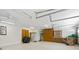 Spacious garage with ample storage, lighting, and room for multiple vehicles and projects at 6213 S Queensway Dr, Temple Terrace, FL 33617