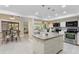 Spacious kitchen with granite countertops, stainless steel appliances and breakfast nook provides ample space for cooking and dining at 6213 S Queensway Dr, Temple Terrace, FL 33617