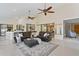 Open-concept living space with neutral colors, comfortable furnishings, and seamless transition to outdoor areas, ideal for relaxation at 6213 S Queensway Dr, Temple Terrace, FL 33617