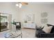 Open living room showcasing bright natural light, elegant decor and seamless indoor/outdoor living at 6213 S Queensway Dr, Temple Terrace, FL 33617