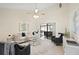 Bright and inviting living room offering an open floor plan and access to outdoor spaces at 6213 S Queensway Dr, Temple Terrace, FL 33617