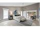 Spacious main bedroom with stylish decor, high ceilings, and sliding glass doors to the lanai at 6213 S Queensway Dr, Temple Terrace, FL 33617