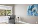 Sitting area with stylish chair next to large window providing natural light at 6213 S Queensway Dr, Temple Terrace, FL 33617