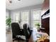 Bright office space with built-in desk and storage, lit by lots of light from three windows at 6213 S Queensway Dr, Temple Terrace, FL 33617