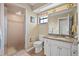 Bathroom featuring shower, toilet and vanity with granite countertop at 6352 Huntington Dr, Zephyrhills, FL 33542