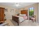 Bedroom featuring a bed and carpeted flooring at 6352 Huntington Dr, Zephyrhills, FL 33542