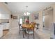 Cozy dining area featuring a wooden table with seating for four, adjacent to the kitchen and living spaces at 6352 Huntington Dr, Zephyrhills, FL 33542