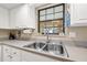 Kitchen with stainless steel sink, granite countertops and window at 6352 Huntington Dr, Zephyrhills, FL 33542