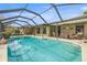 Large screened in in-ground pool with plenty of room for entertaining at 6352 Huntington Dr, Zephyrhills, FL 33542