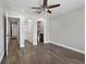 Bright bedroom with hardwood floors, ceiling fan, and access to a closet and bathroom at 6481 64Th N Ave, Pinellas Park, FL 33781