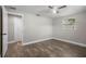 This bedroom has wood floors, a ceiling fan and lots of light at 6481 64Th N Ave, Pinellas Park, FL 33781