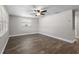 Spacious living room with hardwood floors, ceiling fan, and neutral paint colors at 6481 64Th N Ave, Pinellas Park, FL 33781