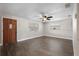 Bright living room with hardwood floors, ceiling fan, and plenty of natural light at 6481 64Th N Ave, Pinellas Park, FL 33781