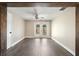 Living room has wood-look flooring, neutral paint and bright windows at 6481 64Th N Ave, Pinellas Park, FL 33781