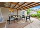 Cozy outdoor patio with seating, perfect for relaxing and enjoying the beautiful weather at 6677 Poinsettia S Ave, St Petersburg, FL 33707