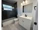 Modern bathroom featuring a glass-enclosed shower and sleek vanity with under sink storage at 6982 79Th N Ave, Pinellas Park, FL 33781