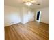 Bedroom with an open concept, laminate flooring and a doorway to a bathroom at 6982 79Th N Ave, Pinellas Park, FL 33781