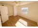 Bright bedroom with a ceiling fan, closet and a large window to allow natural light at 6982 79Th N Ave, Pinellas Park, FL 33781