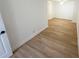 Open concept bedroom with laminate flooring, natural light, and a ceiling fan at 6982 79Th N Ave, Pinellas Park, FL 33781