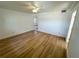Spacious bedroom featuring laminate flooring, a ceiling fan, and ample natural light at 6982 79Th N Ave, Pinellas Park, FL 33781