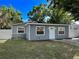 This home features a freshly painted exterior, a well-manicured lawn, and manicured landscaping at 6982 79Th N Ave, Pinellas Park, FL 33781