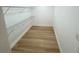A well-organized walk-in closet with wire shelving and laminate flooring at 6982 79Th N Ave, Pinellas Park, FL 33781