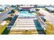 Aerial view of community clubhouse and pool with shuffleboard courts in foreground at 7045 El Dewitt St, Zephyrhills, FL 33541