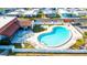 Aerial view of community amenities including the community pool and patio at 7045 El Dewitt St, Zephyrhills, FL 33541