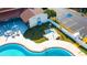 Aerial view of the pool and outdoor hot tub for residents in the Spanish Trails Senior Village community at 7045 El Dewitt St, Zephyrhills, FL 33541