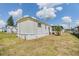 View of the side of the property on a sunny day at 7045 El Dewitt St, Zephyrhills, FL 33541