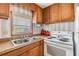 Close-up of a functional kitchen, showcasing cabinets and stove at 7045 El Dewitt St, Zephyrhills, FL 33541
