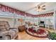Bright sun room with large windows and cozy seating at 7045 El Dewitt St, Zephyrhills, FL 33541