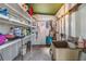 Utility room with lots of storage space, a sink and room to complete your projects at 7045 El Dewitt St, Zephyrhills, FL 33541