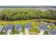 Aerial view of community, showing ponds, green spaces, and residences at 7164 Twisting Pines Loop, Zephyrhills, FL 33541