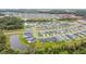 Aerial view of community, showing homes and green spaces at 7164 Twisting Pines Loop, Zephyrhills, FL 33541